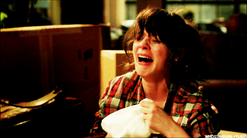 A gif of Jess from the TV series New Girl weeping hysterically.